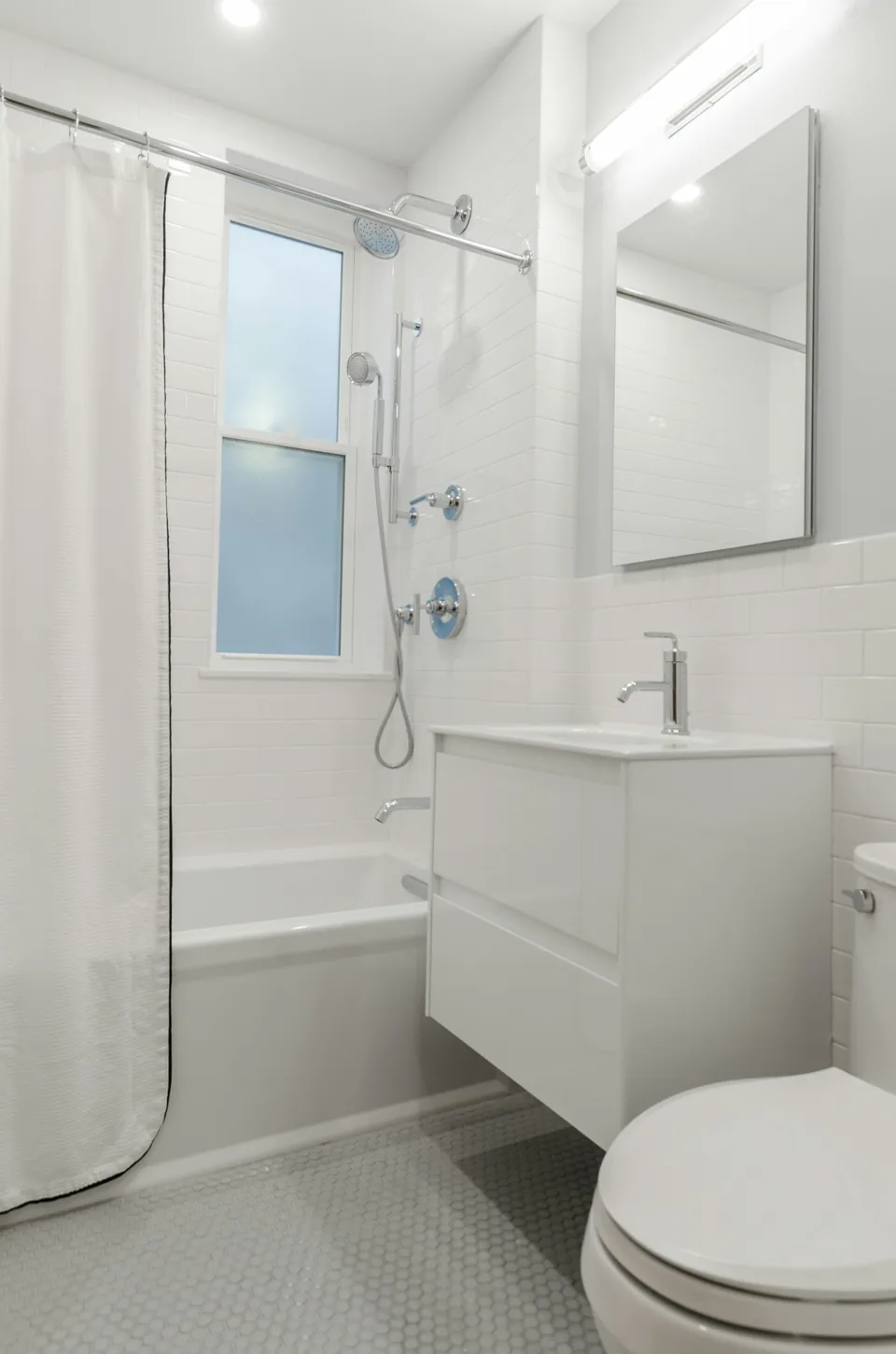 Compact bathroom with a shower and vanity
